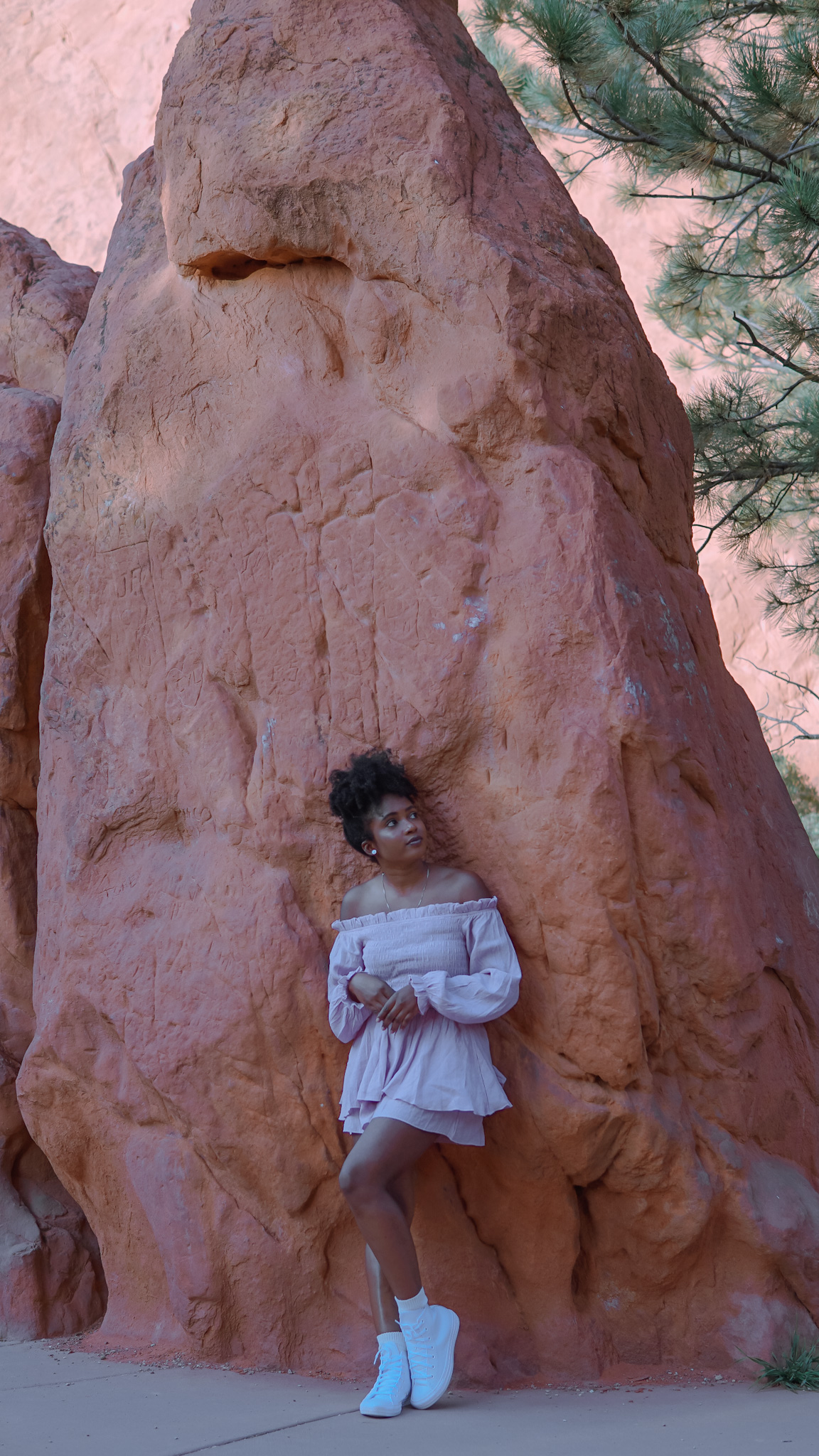 Young woman standing near red rock formations sharing tips on how to overcome a sheltered upbringing