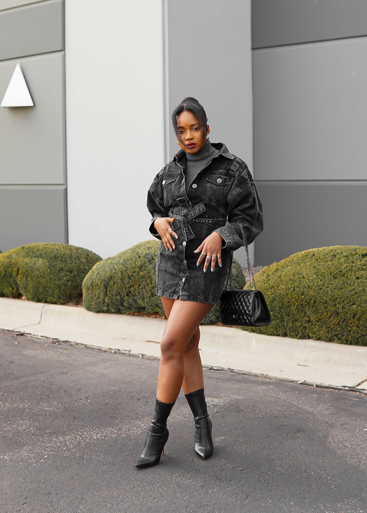 back girl leg cross pose spring denim dress with booties