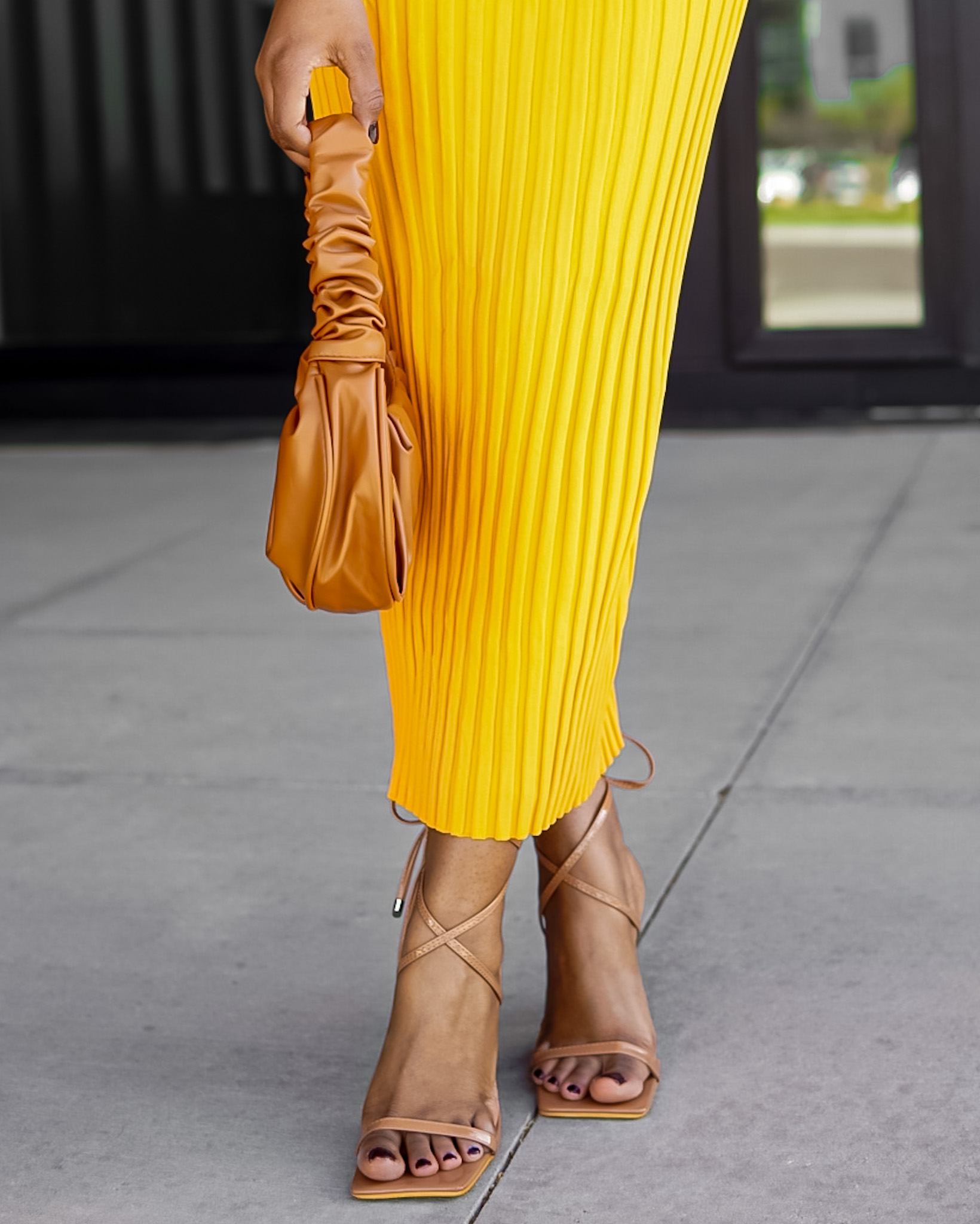 woman midi skirt brown nude bag heels